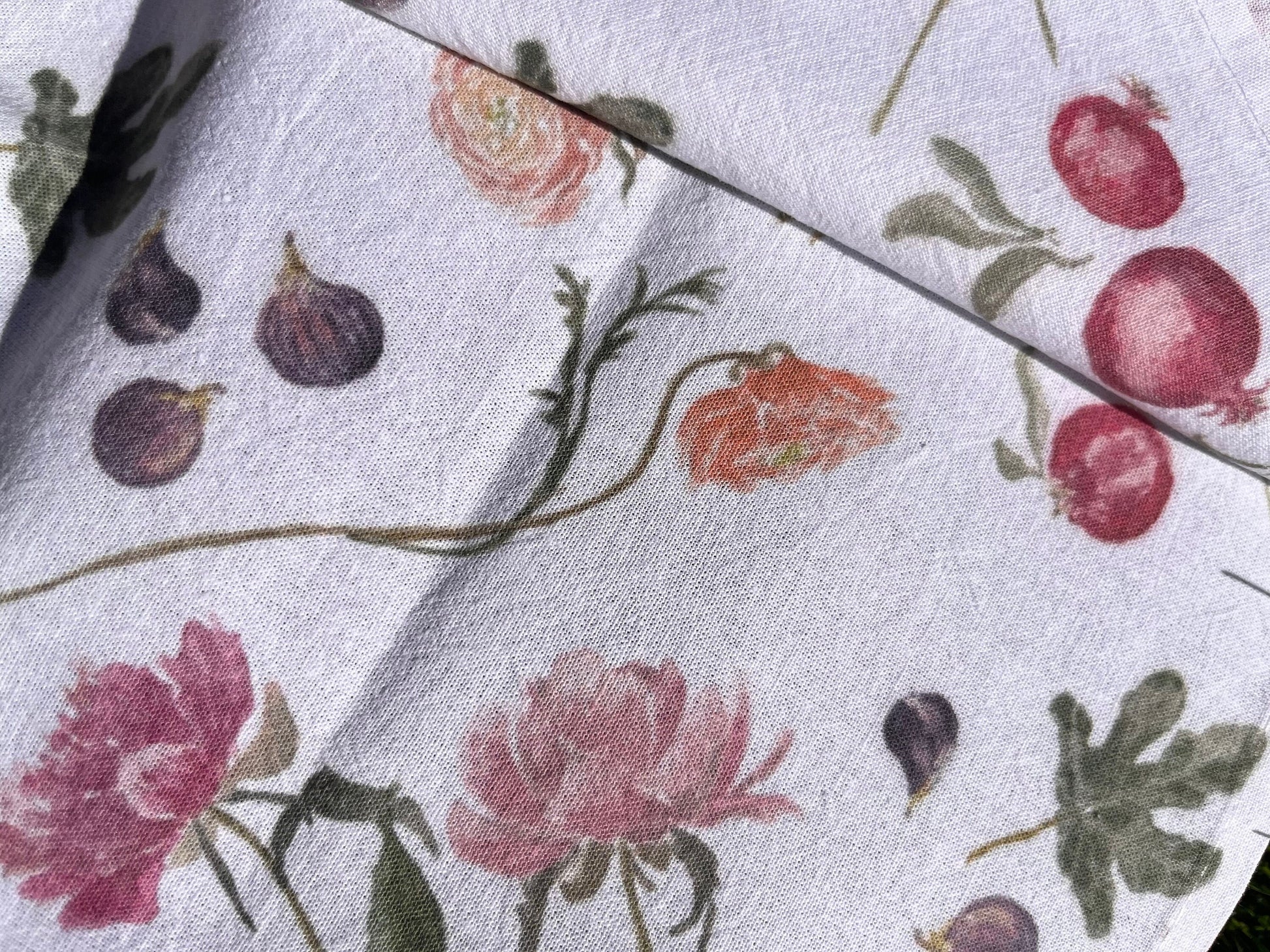 Madeleine tea towel with vibrant hand-painted watercolor pattern of peonies, ranunculus, figs and pomegranates.